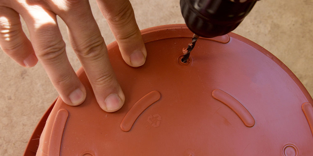 Plant Perfect Garden Center-Bismarck -How to Choose a Container for Your Houseplant-drilling hold in pot bottom