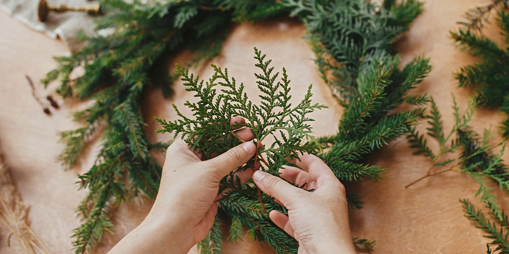 Plant Perfect Garden Center-Bismarck-How to Design a Wreath-adding greens to wreath